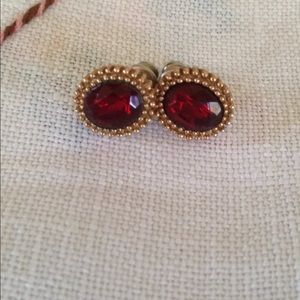 Gold toned earrings with maroon stones